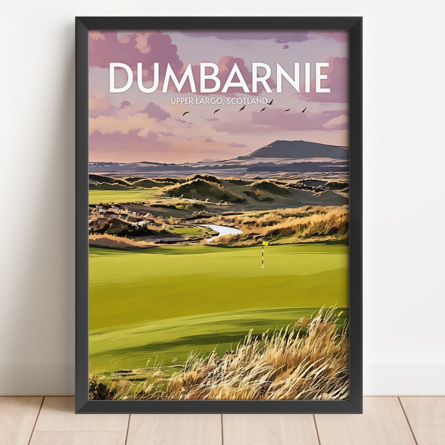 Framed artwork of a golf course with 'Dumbarnie' text on a white wall.