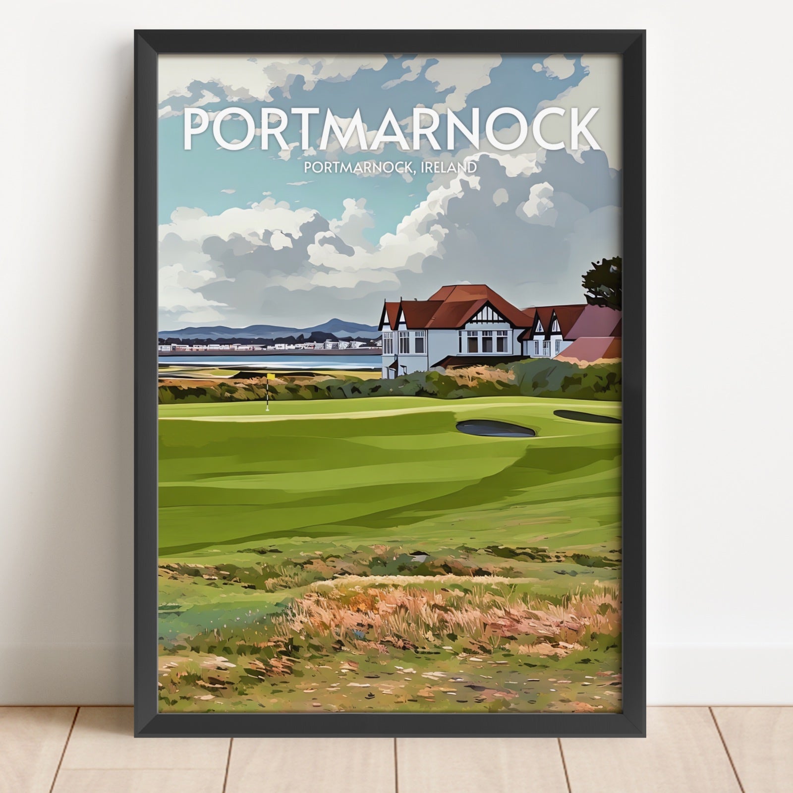 Framed artwork of Portmarnock golf course in Ireland on a white wall.