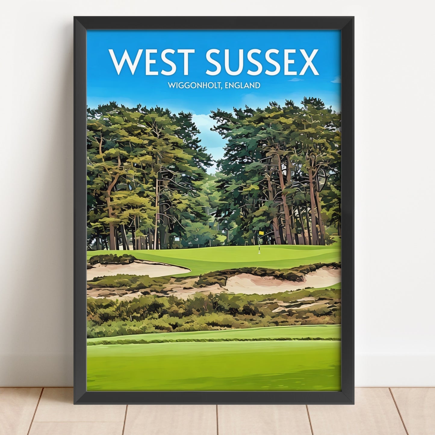 Framed poster of a golf course in West Sussex with trees and blue sky.